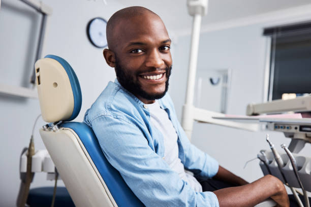 Portrait of a young man having dental work done on his teeth